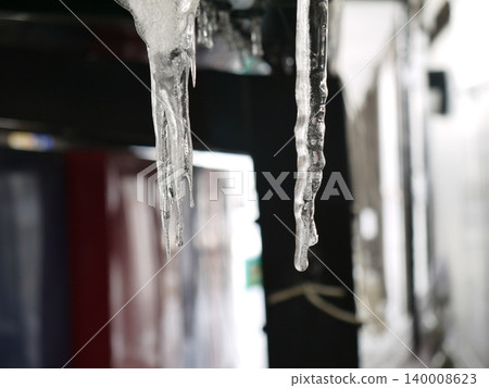 Icicles hanging from the roof Icicles hanging from the roof 140008623
