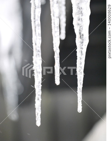 Icicles hanging from the roof Icicles hanging from the roof 140008629