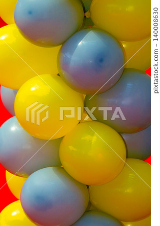 Colorful balloons on wall 140008630