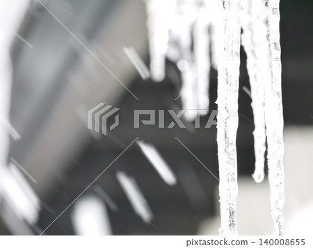 Icicles hanging from the roof Icicles hanging from the roof 140008655