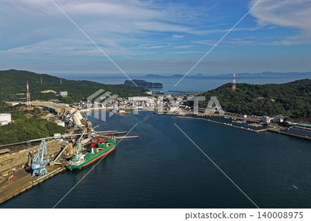 An aerial photograph overlooking the industrial port and bay area of Saganoseki, Oita Prefecture. 140008975