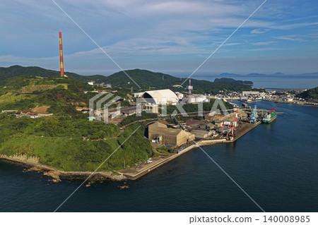 An aerial photograph capturing the industrial port and large chimney in Saganoseki, Oita Prefecture. An aerial photograph capturing the industrial port and large chimney in Saganoseki, Oita Prefecture. 140008985