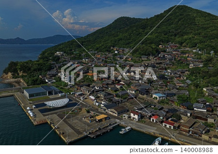 An aerial photograph overlooking the village and harbor on Ogijima Island in Kagawa Prefecture. An aerial photograph overlooking the village and harbor on Ogijima Island in Kagawa Prefecture. 140008988