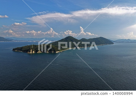 An aerial photograph overlooking Ogijima Island, located in the Seto Inland Sea off the coast of Kagawa Prefecture. An aerial photograph overlooking Ogijima Island, located in the Seto Inland Sea off the coast of Kagawa Prefecture. 140008994