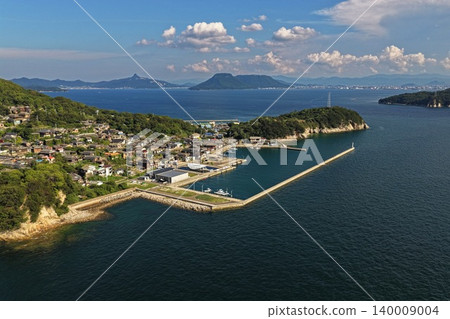 Aerial photograph capturing the fishing port and settlement on Ogijima Island in Kagawa Prefecture. Aerial photograph capturing the fishing port and settlement on Ogijima Island in Kagawa Prefecture. 140009004