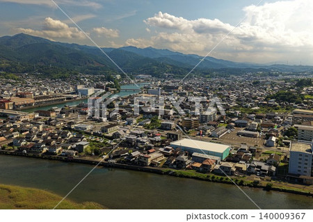 An aerial photograph overlooking the city and river of Usuki, Oita Prefecture. 140009367