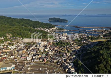 An aerial photograph overlooking the port town and fishing harbor of Saganoseki, Oita Prefecture. An aerial photograph overlooking the port town and fishing harbor of Saganoseki, Oita Prefecture. 140009394
