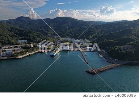 An aerial photograph overlooking the ferry and breakwater lighthouse at Saganoseki Port in Oita Prefecture. An aerial photograph overlooking the ferry and breakwater lighthouse at Saganoseki Port in Oita Prefecture. 140009399