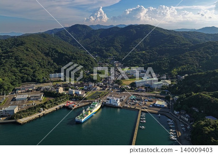 Aerial photograph capturing a ferry and port town at Saganoseki Port in Oita Prefecture. Aerial photograph capturing a ferry and port town at Saganoseki Port in Oita Prefecture. 140009403