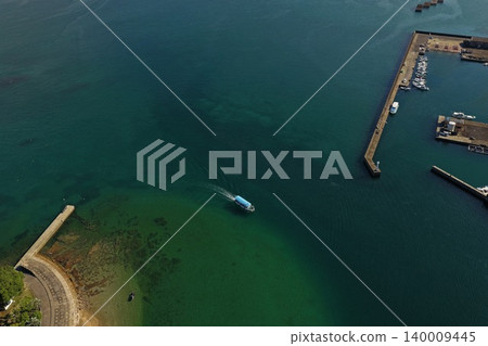 An aerial photograph overlooking the harbor and blue-green sea of Usuki City, Oita Prefecture. An aerial photograph overlooking the harbor and blue-green sea of Usuki City, Oita Prefecture. 140009445