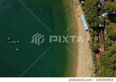 A summer aerial photograph overlooking the beach and stand-up paddleboarding (SUP) in Usuki City, Oita Prefecture. A summer aerial photograph overlooking the beach and stand-up paddleboarding (SUP) in Usuki City, Oita Prefecture. 140009468