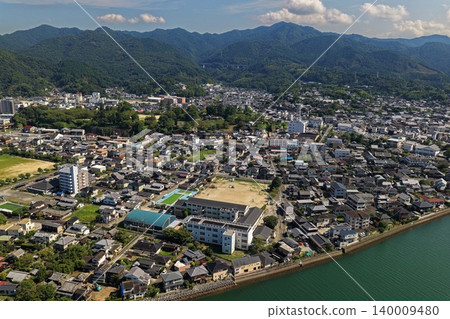 An aerial photograph capturing the city and coastline of Usuki City, Oita Prefecture. An aerial photograph capturing the city and coastline of Usuki City, Oita Prefecture. 140009480