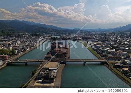 An aerial photograph overlooking the rivers and urban area of Usuki City, Oita Prefecture. An aerial photograph overlooking the rivers and urban area of Usuki City, Oita Prefecture. 140009501