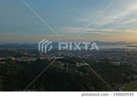 An aerial photograph overlooking Omura City and Omura Bay in Nagasaki Prefecture at dusk. An aerial photograph overlooking Omura City and Omura Bay in Nagasaki Prefecture at dusk. 140009595