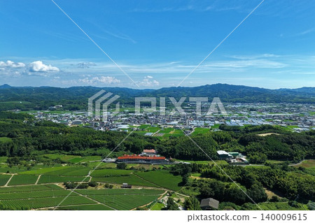 An aerial photograph overlooking the tea plantations and town of Yame City, Fukuoka Prefecture. 140009615