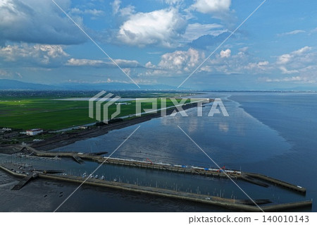 An aerial photograph overlooking the Shin-Ariake fishing port and the Ariake Sea reclaimed land in Kishima District, Saga Prefecture. An aerial photograph overlooking the Shin-Ariake fishing port and the Ariake Sea reclaimed land in Kishima District, Saga Prefecture. 140010143