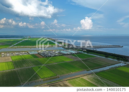 An aerial photograph overlooking the reclaimed land in Kishima District, Saga Prefecture, as well as the Shin-Ariake fishing port and the Ariake Sea. An aerial photograph overlooking the reclaimed land in Kishima District, Saga Prefecture, as well as the Shin-Ariake fishing port and the Ariake Sea. 140010175