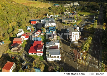 An aerial photograph showing a diagonal view of the hot spring town of Toyotomi Onsen in Hokkaido. 140010204