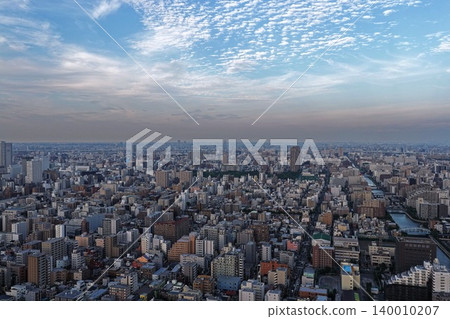 A wide-angle aerial photograph of the urban area of Koto Ward, Tokyo, at dusk. A wide-angle aerial photograph of the urban area of Koto Ward, Tokyo, at dusk. 140010207