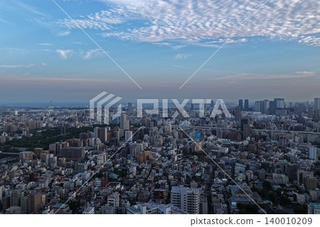 A wide-angle aerial photograph of the urban area of Koto Ward, Tokyo, taken at sunset. A wide-angle aerial photograph of the urban area of Koto Ward, Tokyo, taken at sunset. 140010209