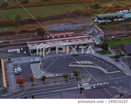 An aerial photograph showing the rotary in front of Kamikawa Station in Kamikawa Town, Hokkaido, viewed from an oblique angle. An aerial photograph showing the rotary in front of Kamikawa Station in Kamikawa Town, Hokkaido, viewed from an oblique angle. 140010287