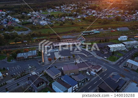 An aerial photograph overlooking the town area around the train station in Kamikawa, Hokkaido, at dusk. An aerial photograph overlooking the town area around the train station in Kamikawa, Hokkaido, at dusk. 140010288