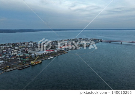 Aerial photograph capturing the peninsula-shaped town and harbor of Akkeshi, Hokkaido. Aerial photograph capturing the peninsula-shaped town and harbor of Akkeshi, Hokkaido. 140010295