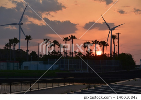 June, sunset seen over windmills from Ryuyo Marine Park Auto Campground in Shizuoka Prefecture. June, sunset seen over windmills from Ryuyo Marine Park Auto Campground in Shizuoka Prefecture. 140010842