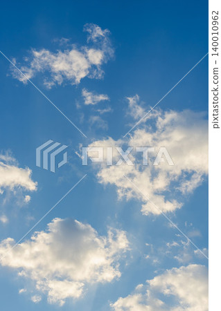 A close-up of clouds shining in the clear blue sky and morning sun on a cold winter morning 03 A close-up of clouds shining in the clear blue sky and morning sun on a cold winter morning 03 140010962