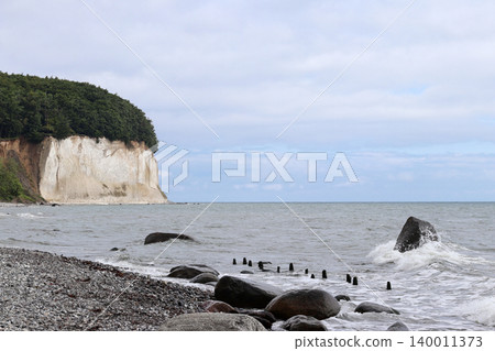 Chalk Cliffs and Pebble Beach Near Sassnitz city, Germany Chalk Cliffs and Pebble Beach Near Sassnitz city, Germany 140011373