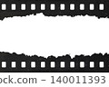 Tattered celluloid filmstrip with natural rough dust and scratches 140011393