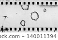 Damaged an old celluloid film strip with dust and scratches 140011394