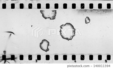 Damaged an old celluloid film strip with dust and scratches Damaged an old celluloid film strip with dust and scratches 140011394