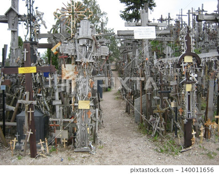 The landscape of the Hill of Crosses, surrounded by countless crosses as you walk along. The landscape of the Hill of Crosses, surrounded by countless crosses as you walk along. 140011656