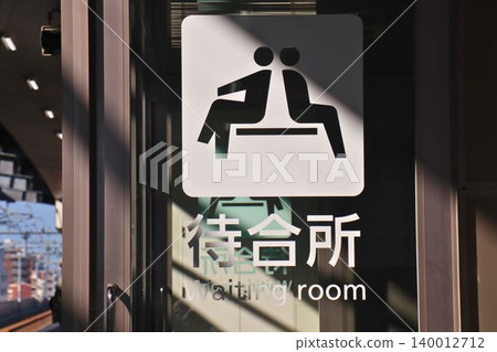 Waiting area sign displayed on glass surface Waiting area sign displayed on glass surface 140012712