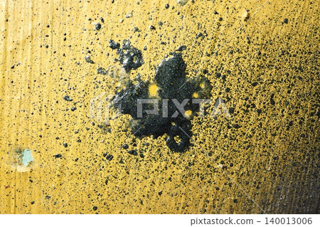 Yellow Metal Surface with Large Black Tar Splatter and Scattered Spots, Bold Industrial Abstract Texture Background 140013006
