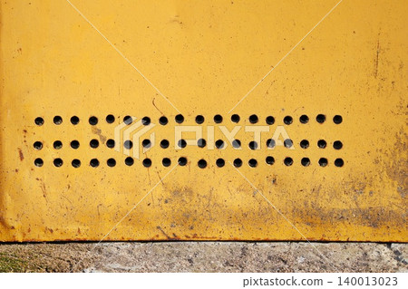 Yellow Orange Weathered Metal Panel with Punched Hole Pattern, Industrial Grunge Texture Background Yellow Orange Weathered Metal Panel with Punched Hole Pattern, Industrial Grunge Texture Background 140013023