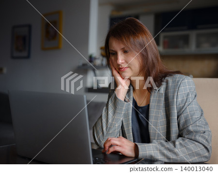 Worried professional business woman reading bad news at work. Worried professional business woman reading bad news at work. 140013040