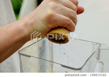 Grinding spices and shaking them in dish. Spices in food. Grinding spices and shaking them in dish. Spices in food. 140013182