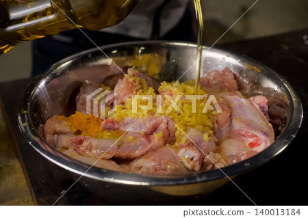 pour chicken meat with sunflower oil. meat pour chicken meat with sunflower oil. meat 140013184