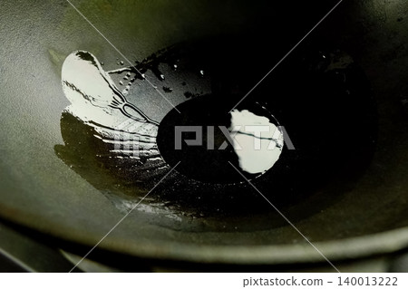 Oil in pan, pouring oil into the pan before frying Oil in pan, pouring oil into the pan before frying 140013222