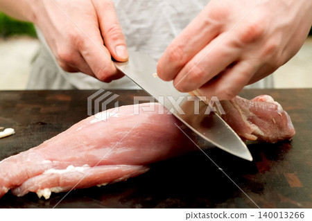 Cutting piece of pork meat on the table. Raw pork. Cutting piece of pork meat on the table. Raw pork. 140013266