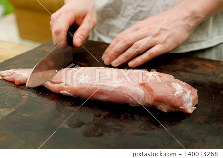 Cutting piece of pork meat on the table. Raw pork. Cutting piece of pork meat on the table. Raw pork. 140013268