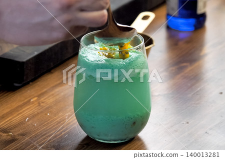 Green smoothie in glass with the addition of sweets. 140013281