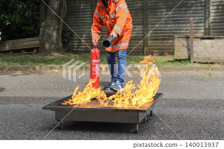 fire prevention. corporate safety - exercise during a firefighting course fire prevention. corporate safety - exercise during a firefighting course 140013937