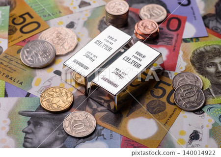 A silver bar, white metal against a backdrop of Swiss flag, as a concept for the sales. A silver bar 140014922