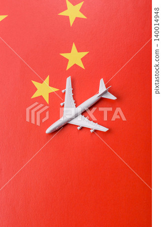 An airplane on the china flag as a conceptual backdrop for travel. An airplane on the china flag 140014948