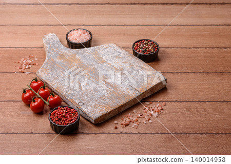 Empty wooden cutting board for preparing ingredients for home cooking. An empty cutting board Empty wooden cutting board for preparing ingredients for home cooking. An empty cutting board 140014958