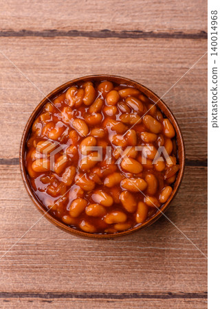 Beans in tomato sauce, a canned stew for the dinner table. Beans in tomato sauce Beans in tomato sauce, a canned stew for the dinner table. Beans in tomato sauce 140014968