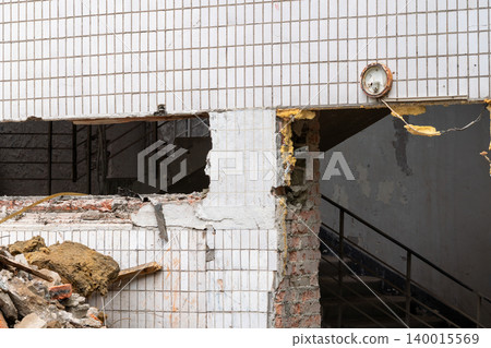 Partially Demolished Tiled Building With Exposed Staircase, Rubble, Insulation and Urban Decay 140015569